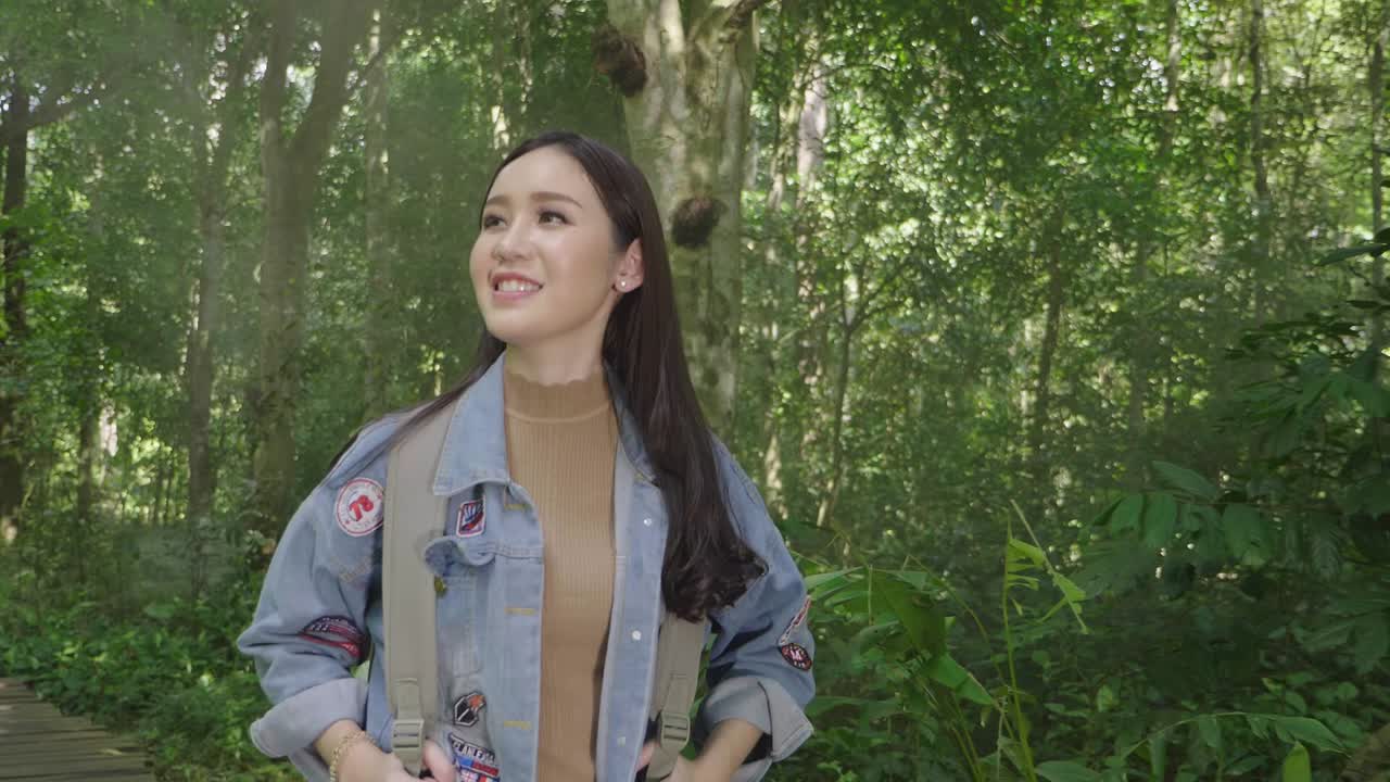 Asian Girl Walk And Looking Around In Tropical Forest, Slow Motion