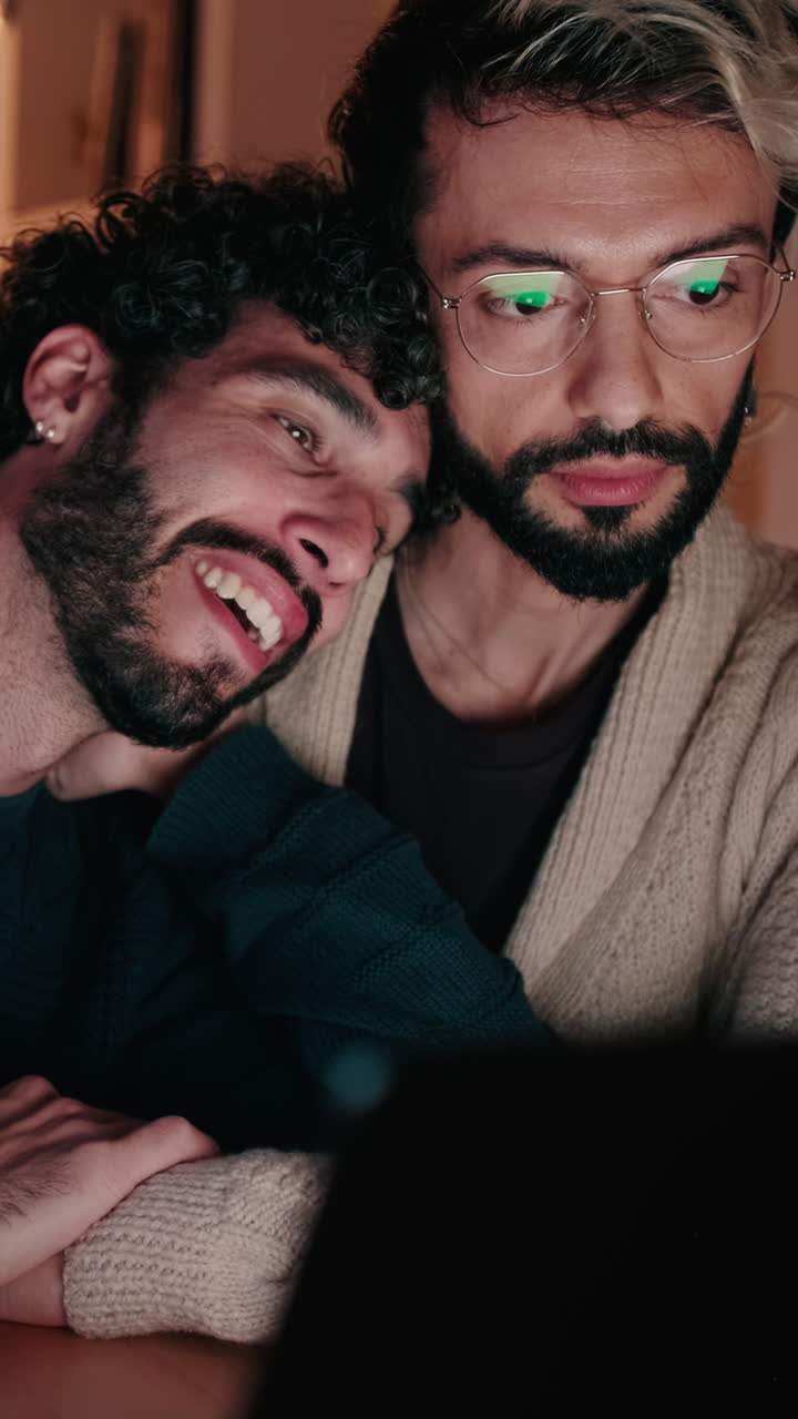 Gay Couple Using Laptop at Home