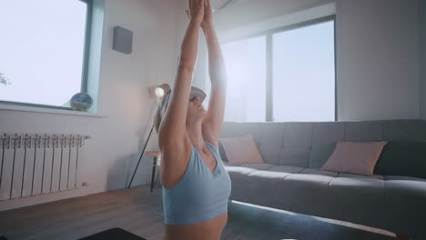 woman practicing vr yoga at home