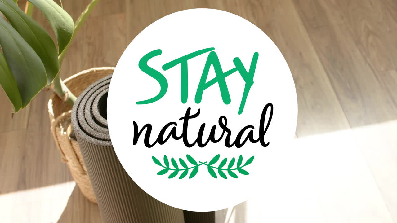 STAY natural text animation over yoga mat and plant on wooden floor