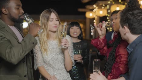 Medium-Shot-of-People-Being-Joined-by-Friends-at-a-Bar