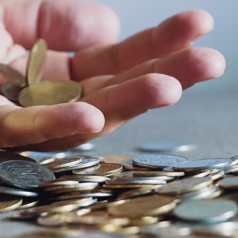 man is holding coins in his hands. man's hands hold a lot of gold coins. financial, business concept.