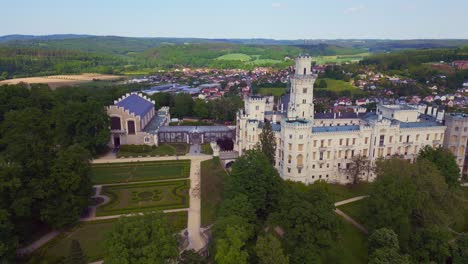 dramatic aerial top view flight fairy tale castle in czech republic europe, summer day 2023