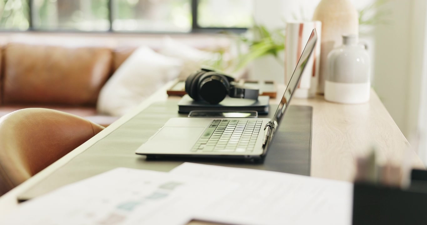 Laptop and Headphones on a Modern Home Office Desk