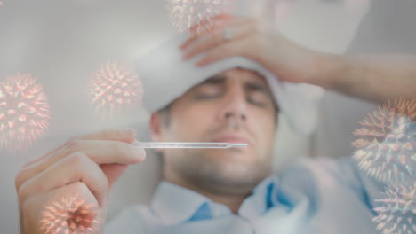 hombre comprobando la fiebre en el termómetro y la célula bacteriana 4k