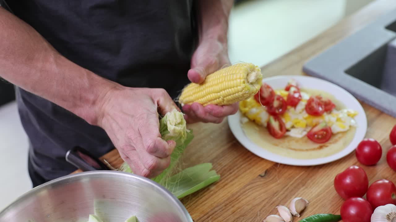 Preparing Corn and Eggs with Tomatoes