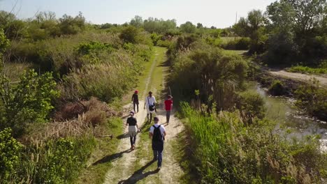 People-are-walking-on-a-natural-path-in-Camargue,-south-of-France