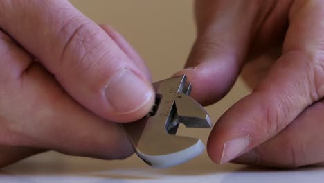 man adjusting adjustable wrench, spanner close up