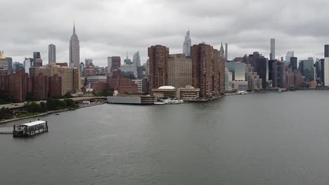 new york city and empire state building drone shot on an overcast day
