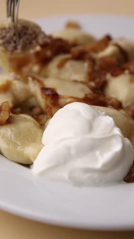 pierogi with sour cream and onions