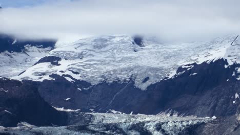 low clouds over the mountain and the john hopkins glacier in alaska