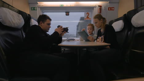 creating footage of mom and child using pad during train travel