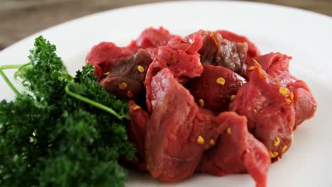 Marinated-raw-meat-pieces-and-herbs