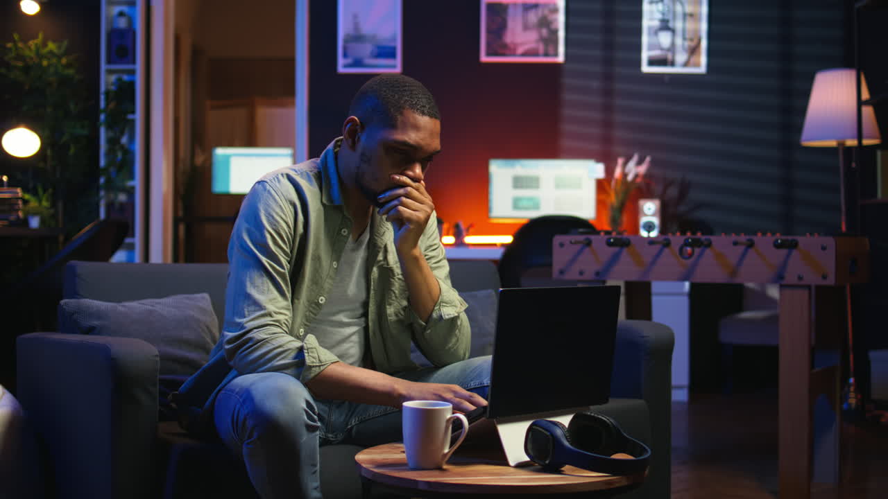 Vertical Video African american guy being overworked with headache at modern loft