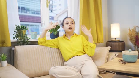 unwell young woman watches out the window to relax.