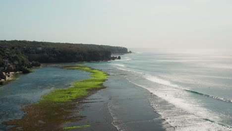 the town of bingin at the cliffs of uluwatu during low tide