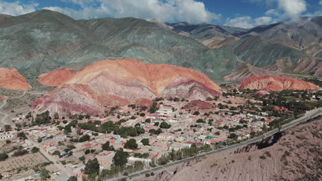 Aerial-View-Of-The-Purmamarca-Cerro-Siete-Colores-Town,-Unesco-World-Heritage-Site,-Jujuy,-Argentina