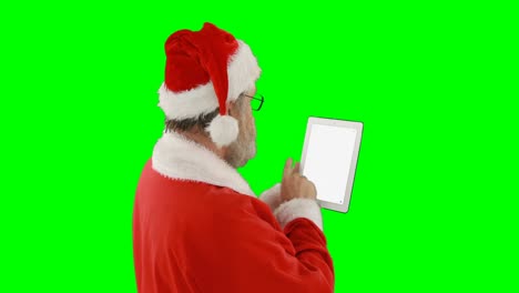 Santa-claus-using-digital-tablet