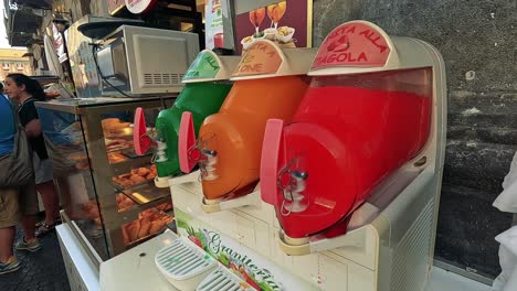 colorful drinks and pizza on display