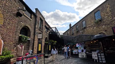 people exploring camden town market in london