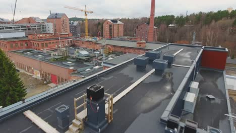 Aerial-view-of-a-construction-site-with-cranes-and-machinery