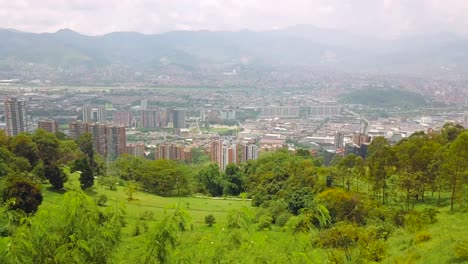 Stunning-revealing-aerial-shot-of-panorama-and-skyline-of-Medellin