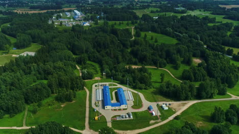 aerial drone dolly forward shot of a natural gas pumping station facility