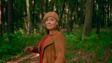 Caucasian-women-with-coat-and-cap-enjoying-the-enticing-view-of-nature-and-looking-around