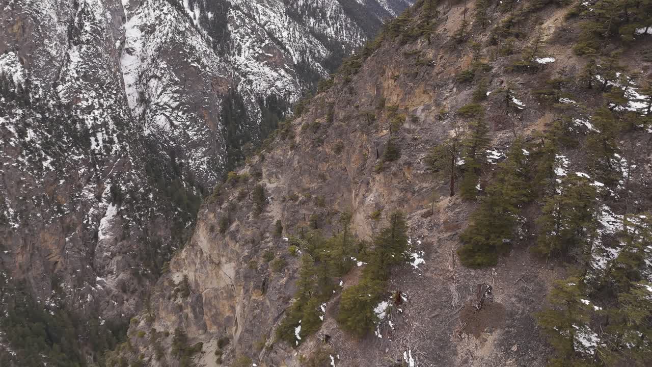 Stunning Aerial Landscape of Rugged Mountains and Snow-Dusted Forests in British Columbia, Canada