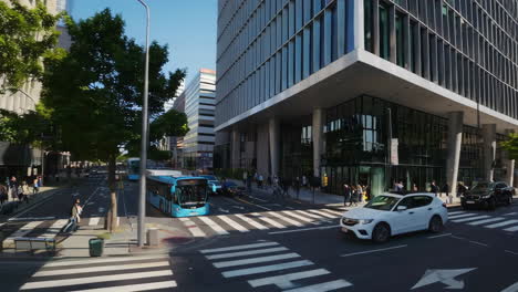 bustling city street with modern buildings and vehicles