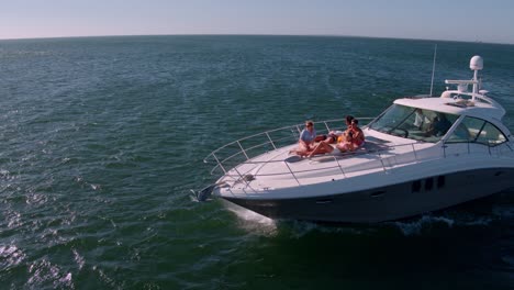 friends relaxing on private yacht deck