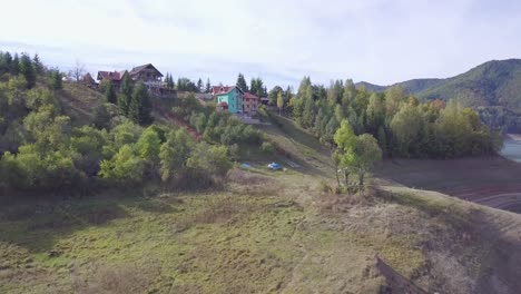 Incredible-establishing-4k-shot-of-mountains,-village-and-lake-in-Tara-mountain