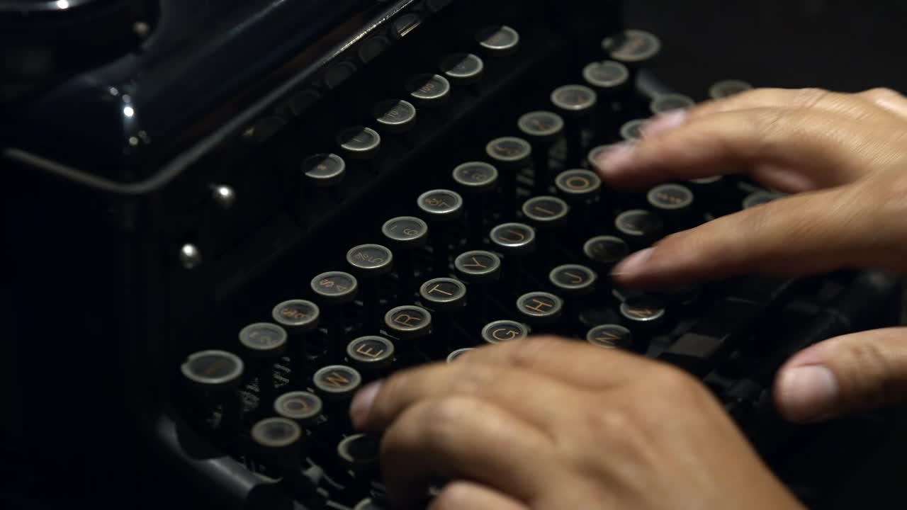 Hands Of A Writer Typing On Antique Typewriter