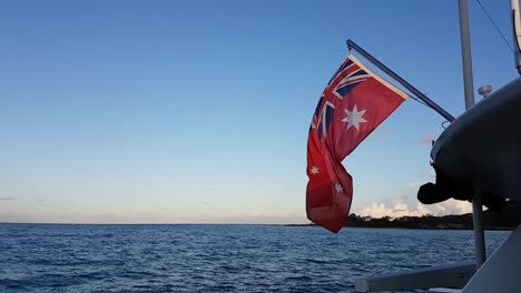 flag on a yacht waving and rolling in the breeze