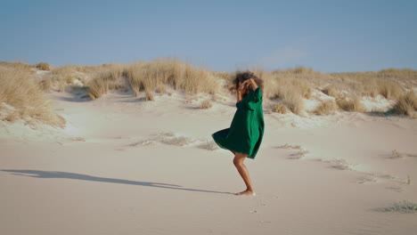 woman dancing modern dunes. girl dancer performing on sand desert summer day.