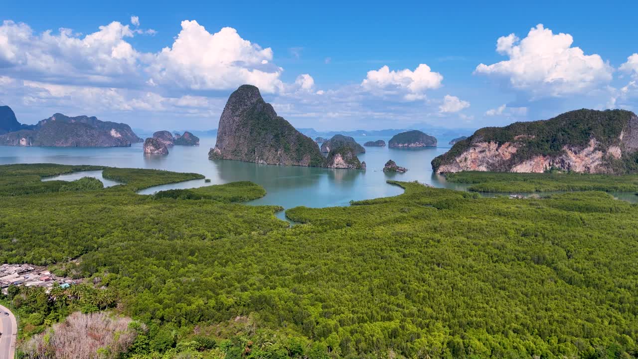 Drone footage captures the stunning landscape of Phang Nga Bay, showcasing lush mangroves, turquoise waters, and dramatic limestone formations
