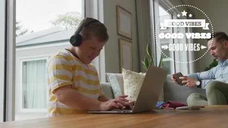 animation of good vibes text over caucasian boy using laptop with father