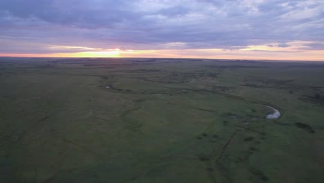 sunset over a grassy plain