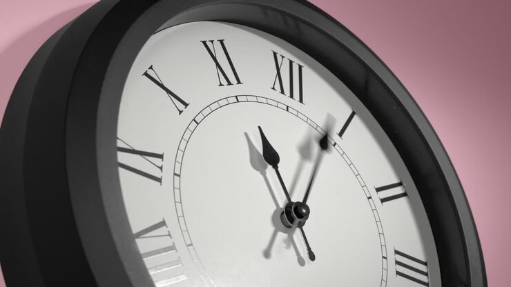Latin Clock Face on Rosy Rose Pink Wall in Time Lapse