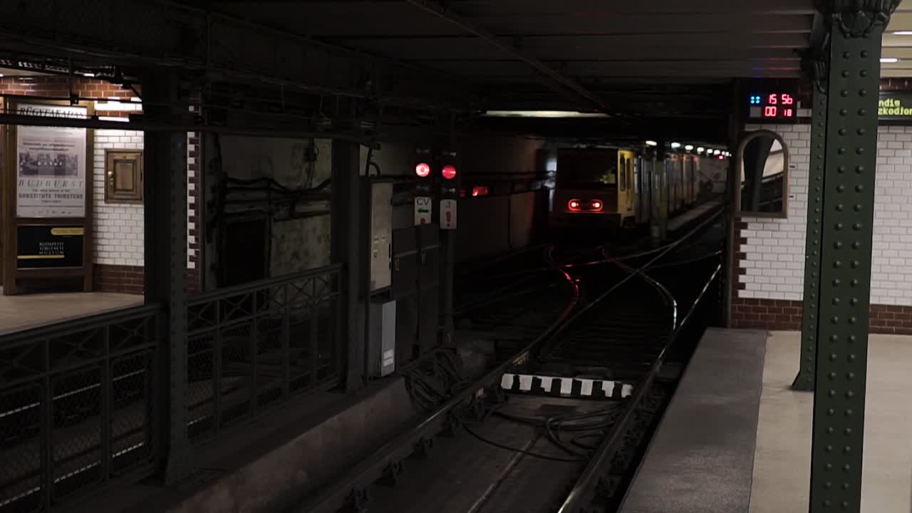 Standing on the Vörosmarty square metro platform watching a tram leave the station