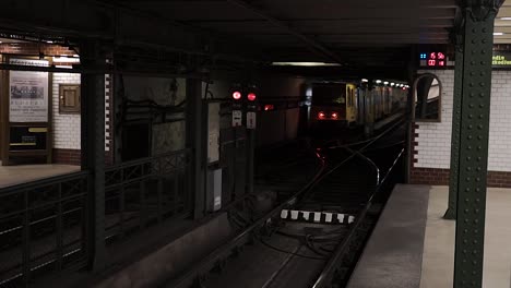 standing on the vörosmarty square metro platform watching a tram leave the station