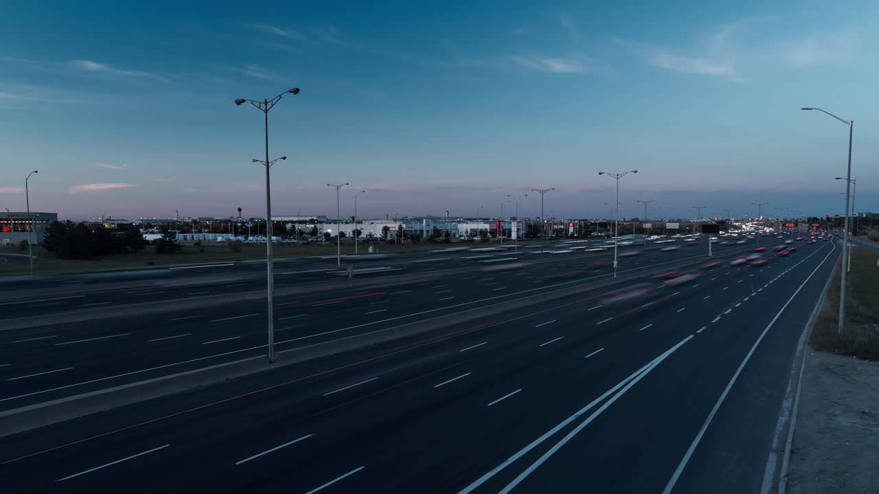 Timelapse of Highway 401 Ontario at dusk with moving vehicles