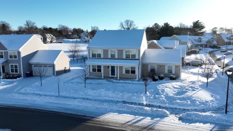 approaching flight of beautiful snow capped home in american small population