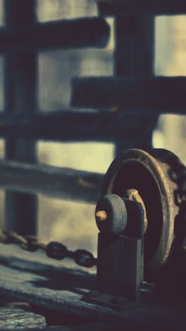 close-up of a rusty old wheel with chain