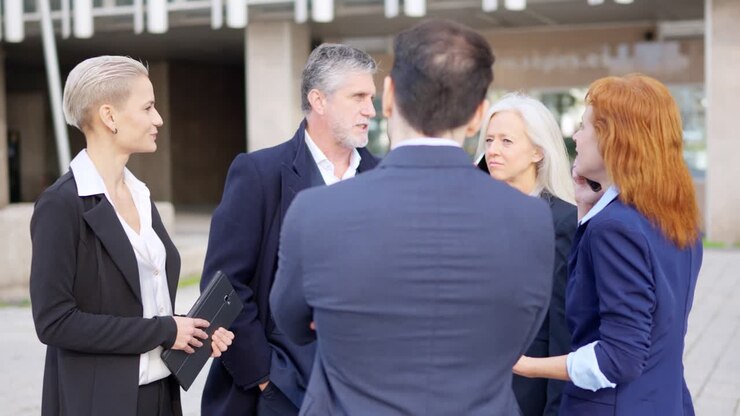 Business Professionals Having an Outdoor Meeting and Discussion