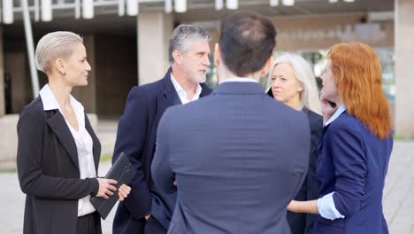 business professionals having an outdoor meeting and discussion