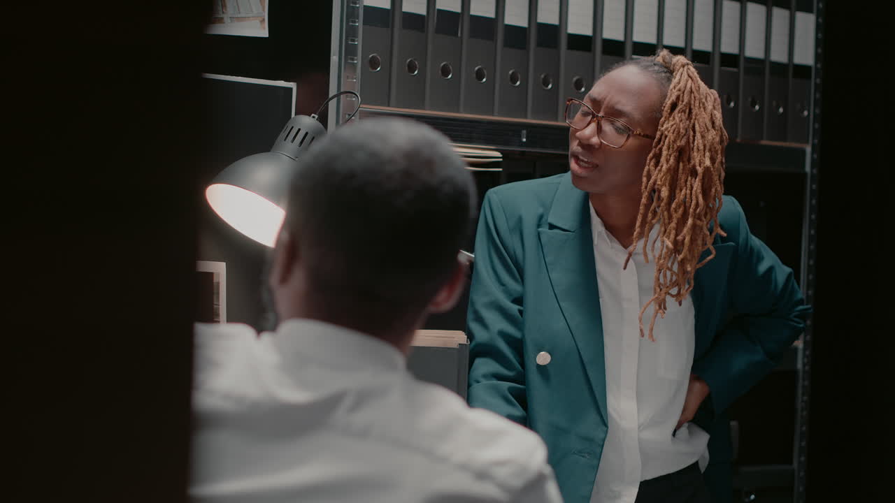 Two people in an office having a conversation