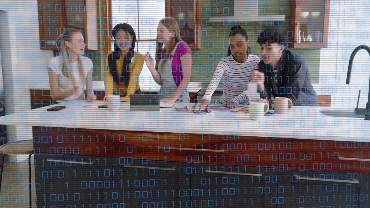 Five adults designing island, pointing tablet as man arriving with pages, binary overlay over group