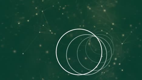 Animation of white rings rotating, over network of connections on green background