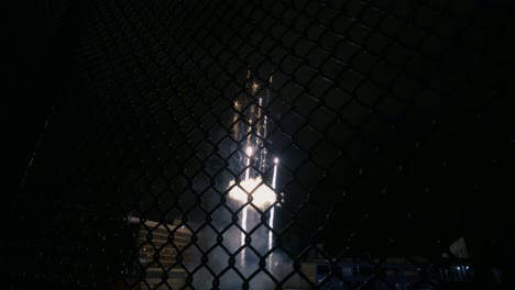 fireworks downtown showing through the fence